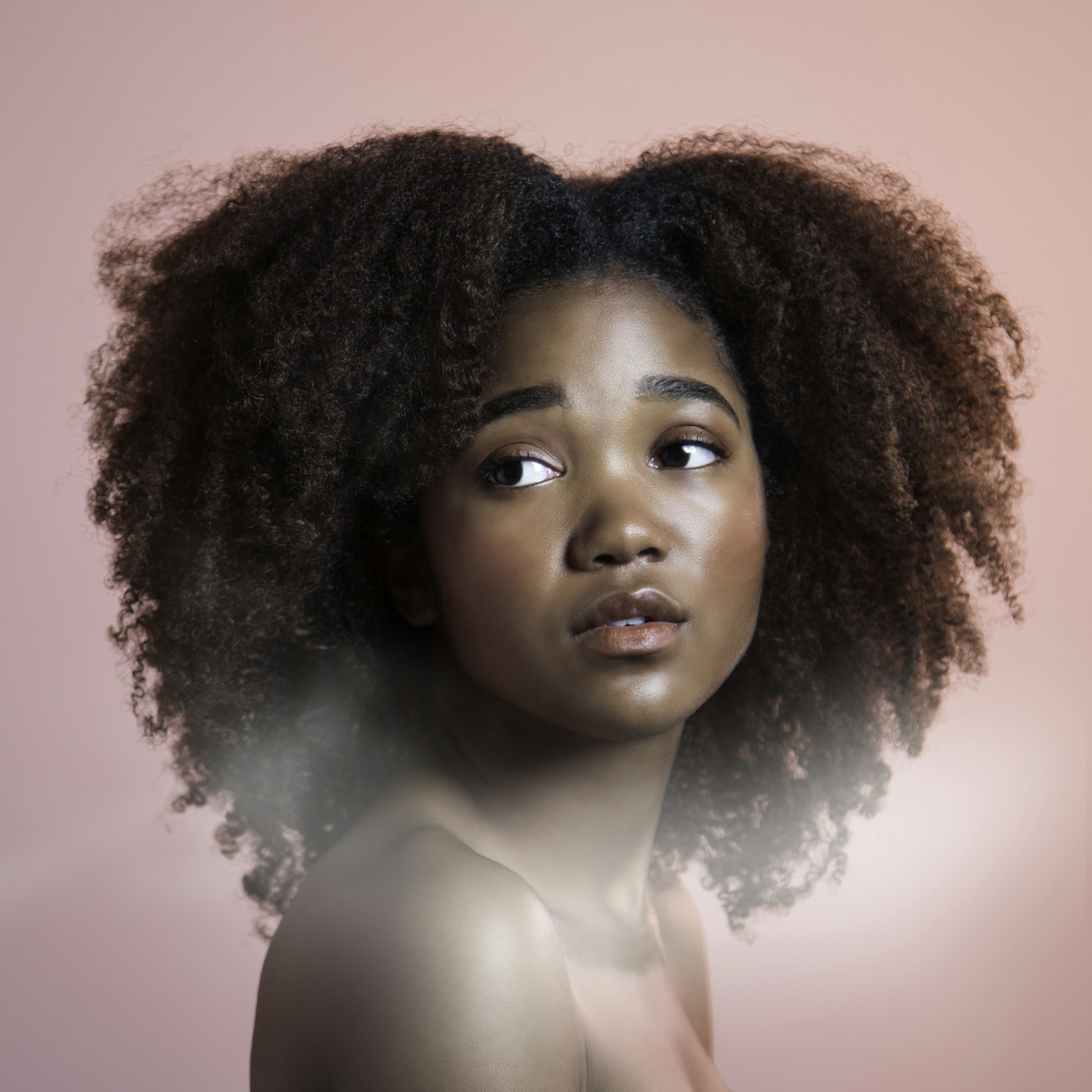 Woman with long flowing hair in soft natural light